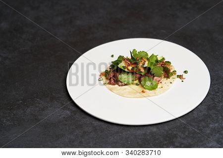 Mexican Tacos With Beef, Tomatoes, Avocado, Chilli And Onion