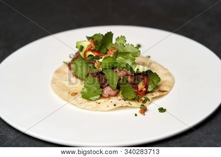 Mexican Tacos With Beef, Tomatoes, Avocado, Chilli And Onion