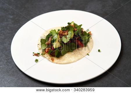 Mexican Tacos With Beef, Tomatoes, Avocado, Chilli And Onion