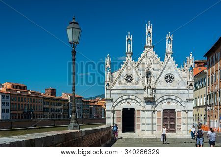Pisa, Italy - June 6, 2019 : Santa Maria della Spina is a small white marble church alongside the Arno, attributed to Lupo di Francesco (1230). It is another excellent Gothic building.