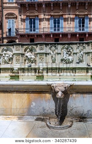 Siena, Italy - June 7, 2019 : The Fonte Gaia (Fountain of the World) is a monumental fountain built in 1419 as an endpoint of the system of conduits bringing water to the city s centre.