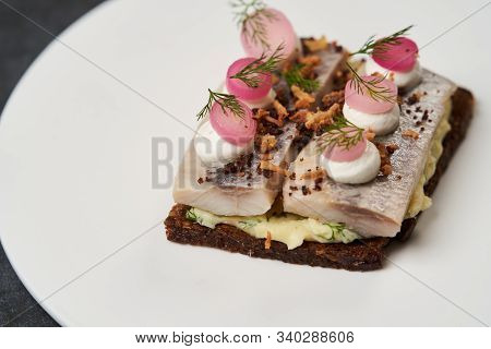 Smorrebrod With Baltic Herring Fish, Smoked Mousse And Pickled Onions