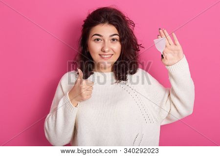 Close Up Portrait Of Woman Holding Menstrual Cup Isolated Over Purple Studio Background, Happy Femal