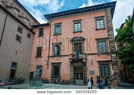 Lucca, Italy - June 6, 2019 : The institute of Musical Studies and the statue of Luigi Boccherini, an Italian composer and cellist of the Classical era.