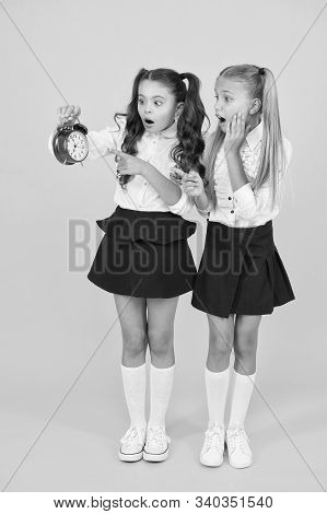 Latecomer Will Be Punished. It Is Time. School Schedule. School Time. Schoolgirls And Alarm Clock. C
