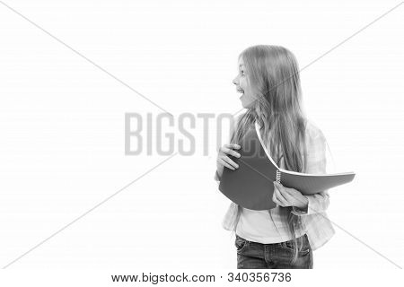 Back To School Goods. Cute Little Girl Holding School Exercise Book. Adorable Small School Child Wit