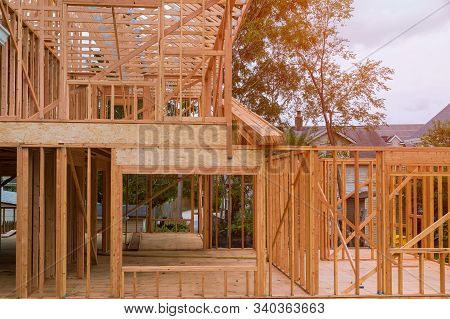 New Construction Of Beam Construction House Framed The Ground Up Framing Against A Blue Sky