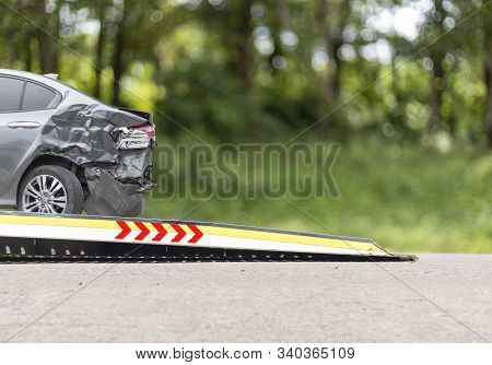Accident Car Slide On  Truck For Move. White Car Have Damage By Accident On Road Take With Slide Tru