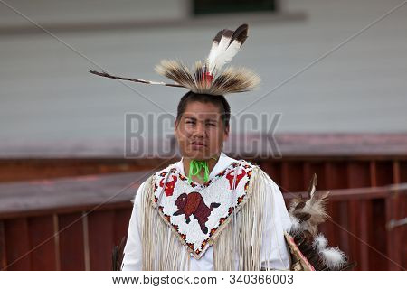 Custer, South Dakota - June15, 2014: A Native American Man In Tribe Specific Clothing Performing In 