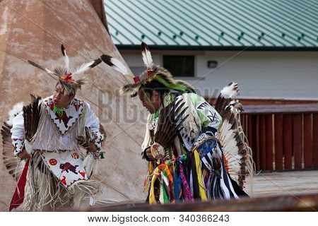 Custer, South Dakota - June15, 2014: Two Native American Men In Tribe Specific Clothing Performing I
