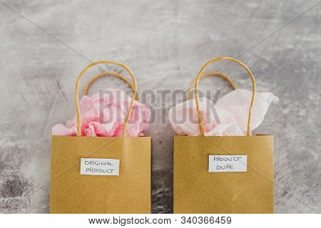 Original Product Vs Dupe Imitation, Shopping Bags With Labels Side By Side With Similar Paper Color