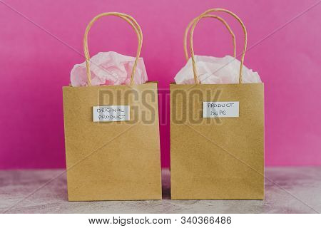 Original Product Vs Dupe Imitation, Shopping Bags With Labels Side By Side With Similar Paper Color
