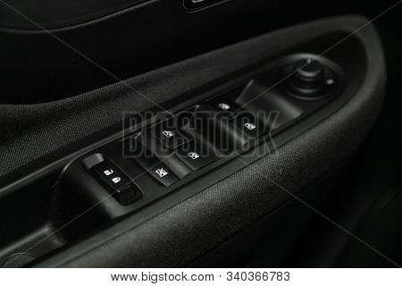 Novosibirsk, Russia - December 06, 2019:  Opel Mokka,  Close-up Of The Side Door Buttons: Window Adj