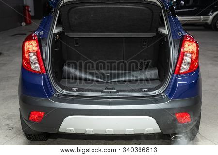 Novosibirsk, Russia - December 06, 2019:  Opel Mokka,  Close-up Of The Open Trunk, Headlight, Bumper