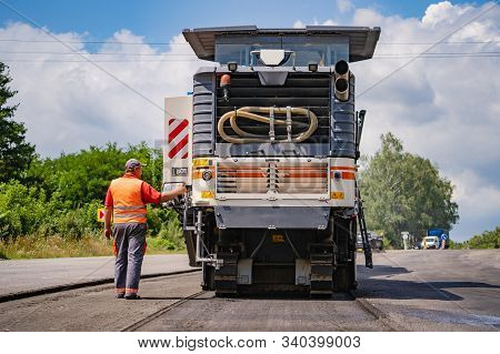 Heavy Vibration Roller At Asphalt Pavement Works, Road Repairing, Construction Site. Full Size, Clos