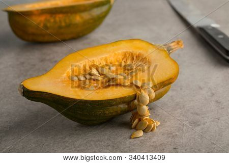 Seed of a halved fresh acorn squash close up in autumn
