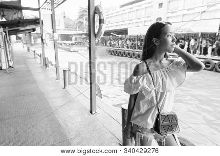 Young Beautiful Tourist Woman Exploring The City Of Bangkok