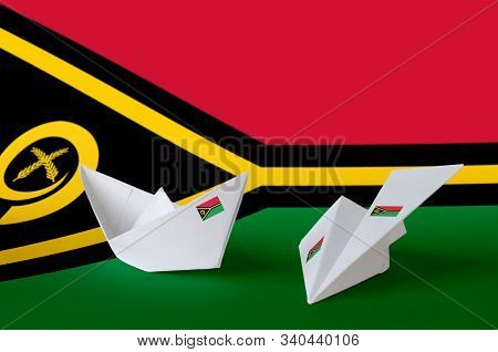 Vanuatu Flag Depicted On Paper Origami Airplane And Boat. Handmade Arts Concept