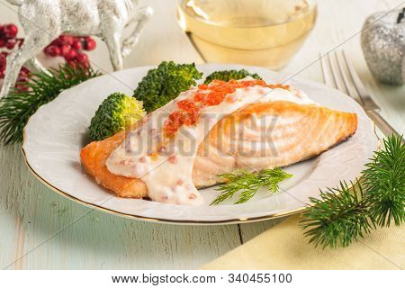 Baked Salmon Fillet With Broccoli And Creamy Sauce. Main Course For Lunch Or Dinner With Christmas D