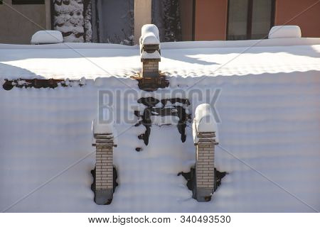 Beautiful Winter View Of Houses And Buildings With Roofs Covered With Heavy Snow. In Snowy Season, R