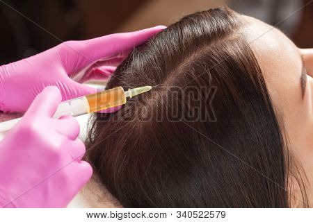 Cosmetologist Does Prp Therapy Against Hair Loss Of A Beautiful Woman In A Beauty Salon. Cosmetology