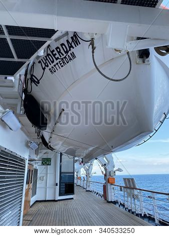 Ft. Lauderdale,fl/usa-11/1/19: An Empty Deck With A Life Boat Above Of A Cruise Ship Sailing On The 