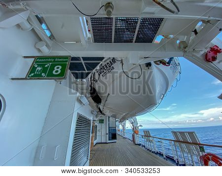 Ft. Lauderdale,fl/usa-11/1/19: An Empty Deck With A Life Boat Above Of A Cruise Ship Sailing On The 