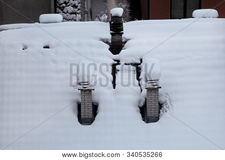 Beautiful Winter View Of Houses And Buildings With Roofs Covered With Heavy Snow. In Snowy Season, R