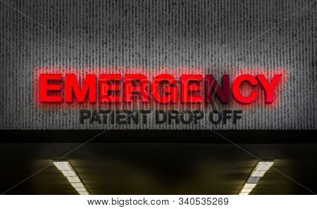 A Rundown Hospital Emergency Room Sign With Broken Light
