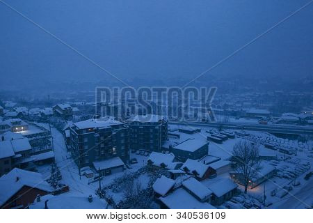 Beautiful Winter View Of Houses And Buildings With Roofs Covered With Heavy Snow. In Snowy Season, R
