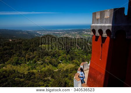Sintra, Portugal - May, 2018: Young Girl Tourist Visiting The Pena Palace A Romanticist Castle Locat