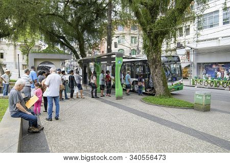 Santos - Sp, Brazil - November 18, 2019: People In Line To Enter The Bus At The Bus Stop, Public Tra