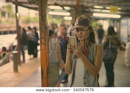 Young Beautiful Asian Tourist Woman Exploring The City Of Bangkok, Thailand