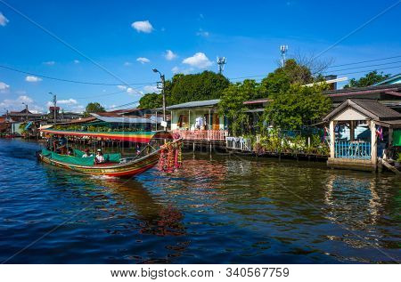 Bangkok, Thailand - November 30, 2019: Long tail boat on Khlong Bangkok Yai canal