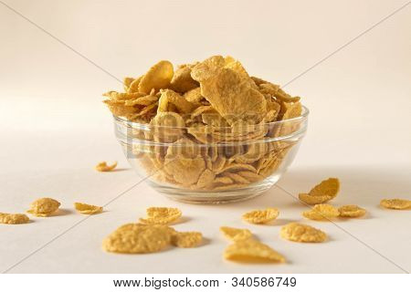 Cornflakes In A Plate On A Light Background. Selective Focus