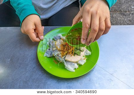 Woman Eating Vietnamese Food- Banh Cuon With Chili Fish Sauce