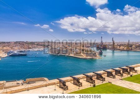 Upper Barrakka Gardens With The Saluting Battery. View Of Valletta Town With Harbor, The Capital Of 