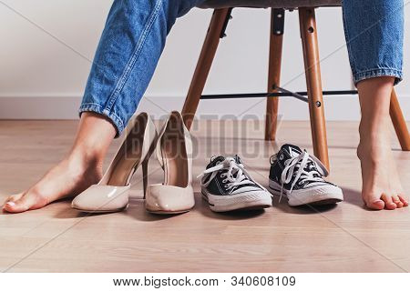 Woman Desiding What To Wear High Heels Or Flat Sneakers.