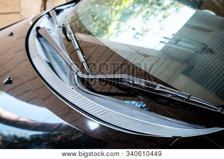Car Windshield Wiper Close-up With Dusty Feature