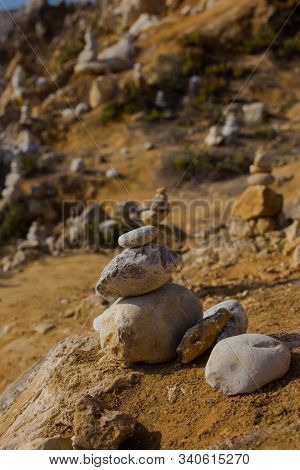 Beach With Stacks Of Rocks Called A Cairns. Peniche Portugal