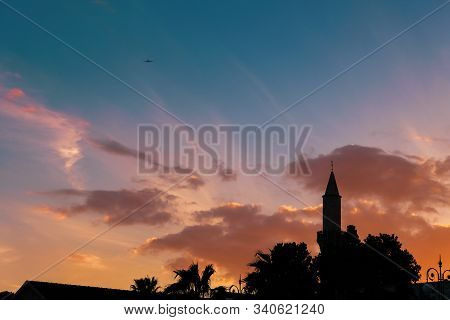 Silhouette Of Buyuk Cami Mosque And Palm Trees