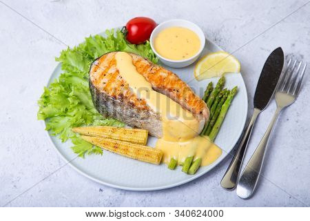 Grilled Salmon With Asparagus, Corn Mini And Hollandaise Sauce. Close-up.