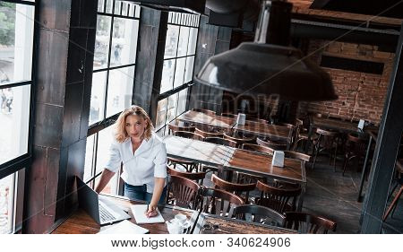 Didnt Saw You There. Businesswoman With Curly Blonde Hair Indoors In Cafe At Daytime.