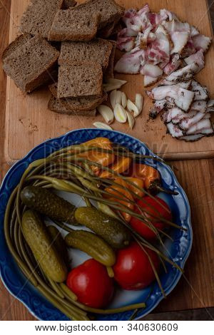 Bacon, Bread And Cucumber Over Wooden Background. Russian And Ukrainian Traditional Appetizer, Black