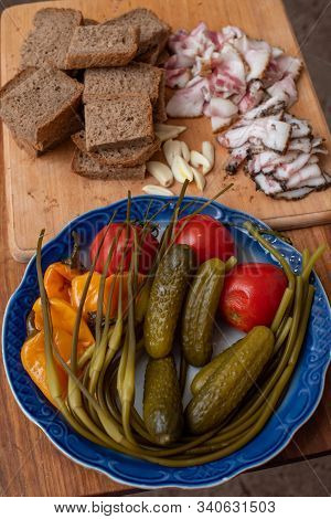 Bacon, Bread And Cucumber Over Wooden Background. Russian And Ukrainian Traditional Appetizer, Black