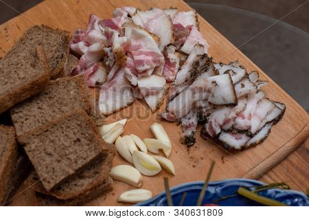 Bacon, Bread And Cucumber Over Wooden Background. Russian And Ukrainian Traditional Appetizer, Black