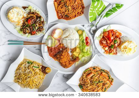 Variety Of Delicious Asia Muslim Malay Daily Home Cooked Food On Table. Flat Lay Top Down Table View
