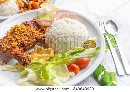 Ayam Penyet Is Indonesian East Javanese Cuisine - Consisting Of Fried Chicken That Is Smashed With T