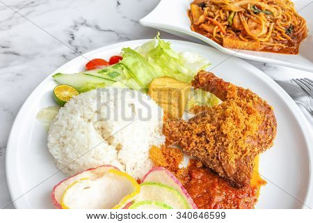 Ayam Penyet Is Indonesian East Javanese Cuisine - Consisting Of Fried Chicken That Is Smashed With T