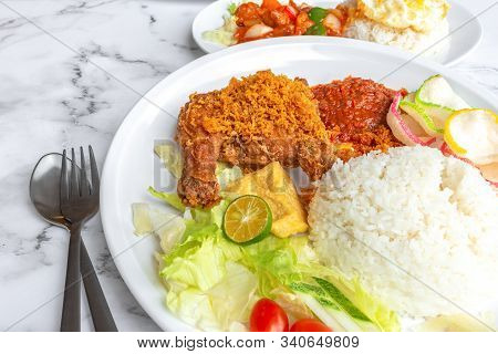 Ayam Penyet Is Indonesian East Javanese Cuisine - Consisting Of Fried Chicken That Is Smashed With T